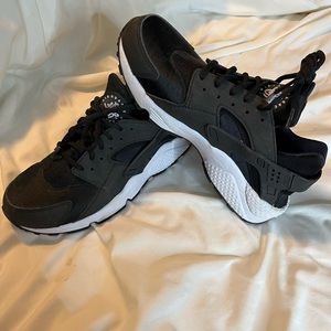 Black and white nike tennis shoe